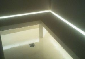 Seduta su misura per sauna in marmo ricomposto (blanzo zues cosentino) con inserto per luce led.